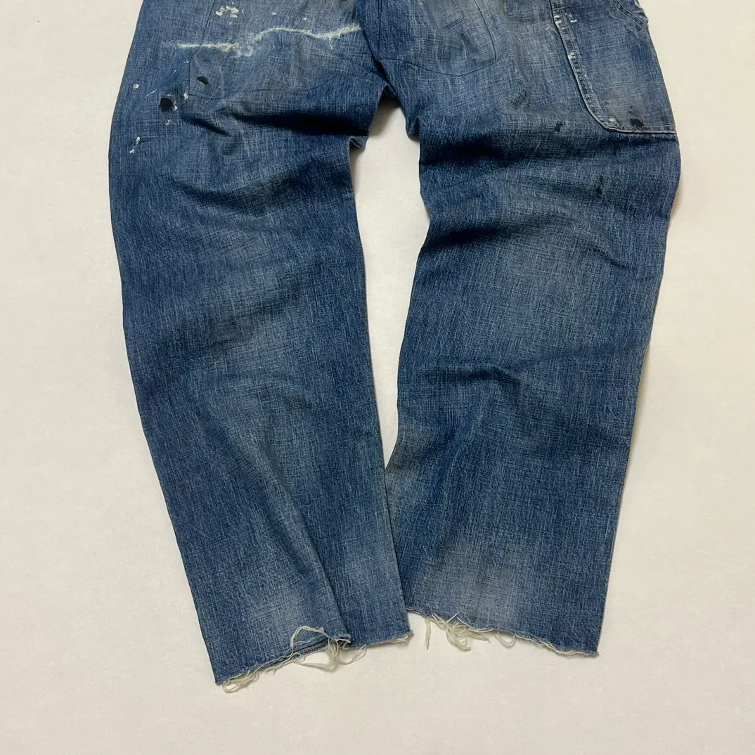 SAINT Mxxxxxx SAINT_DENIM PANTS/PAINTER /BLUE Logging trousers with knife-cut holes and splashed ink. Patch jeans. Blue S-XL. All accessories are molded and customized. Super heavy work. Washed and distressed. Knife-cut holes. Artificial splashed ink graffiti. Authentic version. Loose and stylish.